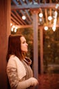 Woman portrait in evening lantern lights.