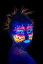 The woman portrait face, aliens portrait in semi-profile, ultraviolet make-up. Beautiful aborigine.
