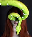 Woman portrait with green tree python