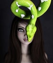 Woman portrait with green tree python