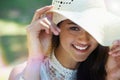 Woman, portrait and happy for hat in park or garden, smiling and joyful on summer holiday. Female person, peace and Royalty Free Stock Photo