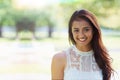 Woman, portrait and happy relaxing in park or garden, smiling and joyful on summer holiday. Female person, peace and Royalty Free Stock Photo