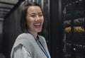 Woman, portrait and happy in server room with information technology, happy in job and datacenter with engineer. Asian Royalty Free Stock Photo