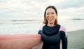 Woman, portrait and laughing for surfing at beach, sea and ocean on summer holiday, travel adventure or fun. Happy Royalty Free Stock Photo