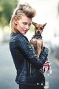 Woman, portrait and leather jacket with pet, smile and rock n roll for unique in punk fashion and love for pet chihuahua Royalty Free Stock Photo