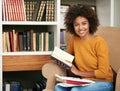 Woman, portrait and library with book or university research with note or education project, academic or scholarship Royalty Free Stock Photo