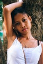 Woman - portrait of lovely and beautiful Asian young girl, outdoor on the tree in the park Royalty Free Stock Photo