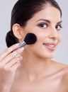Woman, portrait and makeup brush in studio for beauty blush, cosmetics or grey background. Female person, facial contour