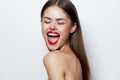 Woman portrait Naked shoulders wide open mouth closed eyes studio red lips