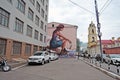 Woman portrait painted on the wall.