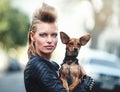 Woman, portrait and punk fashion with pet, edgy and rock n roll for cool in funky clothes and care for chihuahua dog Royalty Free Stock Photo