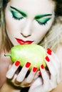 Woman portrait smelling a pear Royalty Free Stock Photo