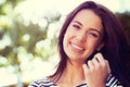 Woman, portrait and smile with nature, sunshine and park for happiness and wellness. Person, joy and bokeh with closeup