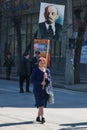 Woman with portrait of the Soviet founder Vladimir Lenin takes part in the May day demonstration in Volgograd