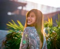 Woman portrait with sunflare on with construction site on the background for developing city woman cocnept