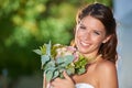 Woman, portrait and wedding rose bouquet with love, commitment and trust ceremony for marriage. Happy, celebration and