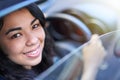 Woman, portrait and window of car for driving, travel and vehicle for trip or journey and commute. Happy female person Royalty Free Stock Photo