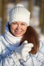 Woman portrait in winter clothes in sunlight Royalty Free Stock Photo