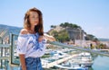 Woman pose on Denia castle and marina background. Spain