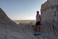 Woman poses at Badlands overlook