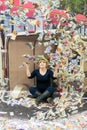Woman Poses with Flying Money for an Illusion