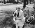 Woman poses with herJack Russell terrier