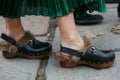 Woman poses for photographers with fur Gucci clogs before Gucci fashion show, Milan Fashion Week Day 1 street