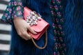 Woman poses for photographers with pink jewel bag and blue fur before Etro and Iceberg fashion show, Milan Royalty Free Stock Photo