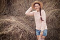 Woman posing against haystacks Royalty Free Stock Photo