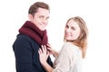 Woman posing and arranging man's autumn casual neckcloth Royalty Free Stock Photo