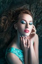 Woman posing on a beach with rocks Royalty Free Stock Photo