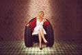 Woman posing in a chair made of tires