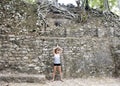 Woman posing in front of a Ruin in the COBA Zona Arqueologica Royalty Free Stock Photo