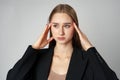 Woman Posing With Hands on Face against gray background Royalty Free Stock Photo