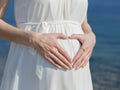 Woman posing heart on her belly Royalty Free Stock Photo