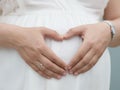 Woman posing heart on her belly Royalty Free Stock Photo