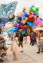 Woman posing with helium balloons at the Oktoberfest