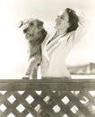 Woman posing with her Airedale at the beach Royalty Free Stock Photo