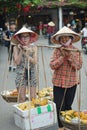 Tourist and fruit vendor, Hoi An, Vietnam