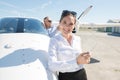 Woman posing next to private plane Royalty Free Stock Photo