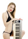 Woman posing with Piano keyboard. Royalty Free Stock Photo