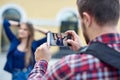 Woman posing for vacation photo in urban city tour