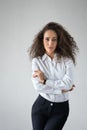 A woman posing on a white background