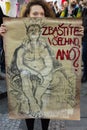 Woman with poster against Babis attending the demonstration on Prague Wenceslas square against the current government