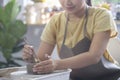 Woman potter making ceramics on pottery wheel. Creative activities, pottery, workshop, ceramics art concept