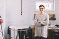 Woman in pottery ceramics workshop, a smiling proud owner Royalty Free Stock Photo