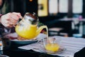 Woman pour tea glass teapot Royalty Free Stock Photo