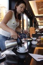 Woman pouring coffee Royalty Free Stock Photo