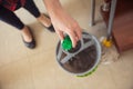 Woman is pouring floor washing liquid from the nut