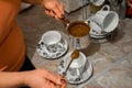 Woman is pouring herself a cup of coffee Royalty Free Stock Photo